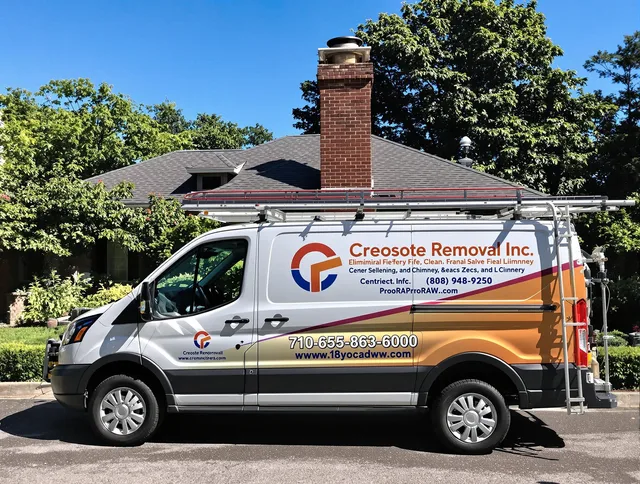 Matthews Chimney Sweep technician removing creosote safely in Matthews, NC