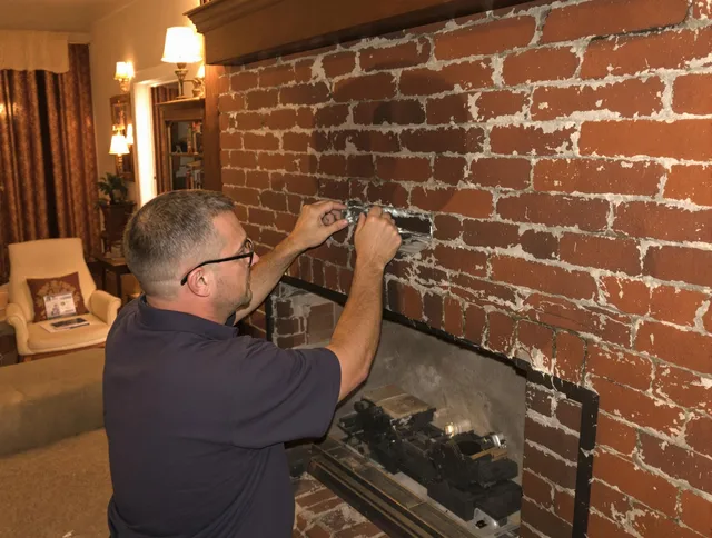 Matthews Chimney Sweep expert fixing a fireplace in Matthews, NC